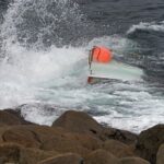 Teen boater found clinging to capsized vessel after 3 go missing; 2 bodies recovered